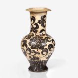 A Chinese Tsu Chou bottle vase Song/Yuan decorated lotus flowers and scrolling foliage in a brown