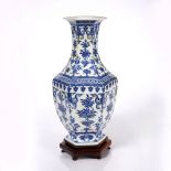 A Chinese blue and white hexagonal vase 19th Century with waisted neck and trumpet mouth decorated