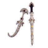 A Persian silver metal Jambiya mounted with semi-precious stones and one other Persian dagger (20