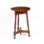 Aesthetic Movement Walnut occasional table octagonal top over triform turned supports 71cm high,