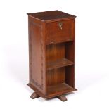 Arts & Crafts - Attributed to Arthur Simpson of Kendal Revolving oak bookcase with cupboards and