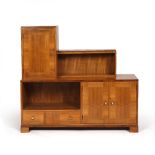 Art Deco School Walnut side cabinet of stepped form with cupboards and open shelves 137cm across,