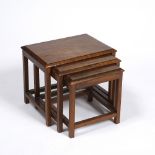 Cotswold School Walnut nest of three tables tops with chamfered edge over square supports 33cm high,