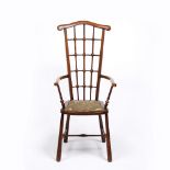 Manner of Liberty & Co. Armchair, circa 1900 with Moorish style beaded back, over open arms and