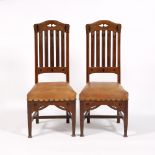 Manner of Mackay Hugh Baillie Scott (1865-1945) Pair of side chairs oak, with ebony inset flower and