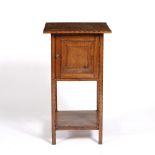 Cotswold School Oak bedside cabinet shaped cupboard door, with chip carved decoration 86cm high.