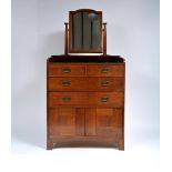 Heals Oak dressing chest, circa 1905 swing mirror over drawers and cupboard section, with stylised