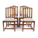 James Cox for Heals A set of four '1020' oak chairs, circa 1920 with shaped rail backs and drop in