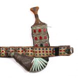 A Qajar Jambiya dagger with metal scabbard set with semi-precious stones and with gilt metal belt