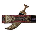 A Qajar Jambiya dagger having a Damascene type scabbard with Korean script and with embroidered