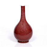 A Chinese sang de boeuf pear-shaped bottle vase 18th/19th Century the pinkish red glaze with areas