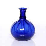 A Indian Mughal Surat blue glass flask 18th/19th Century of ribbed form, 21.25cm high