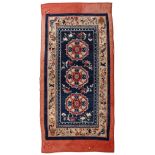 A pair of Chinese rugs each of floral design, having multiple borders with central medallion on a