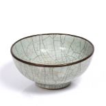 A Chinese crackle glaze celadon bowl 17th/18th Century with later metal rim, 22.5cm