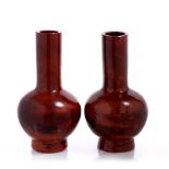 A pair of Chinese Beijing reddish mottled glass bottle vases 19th Century emulating realgar, 12.5cm