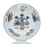 A Chinese Doucai dish 19th Century decorated with an antique vase and other symbols, six character