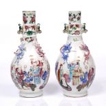 A pair of Canton porcelain vases 19th Century with immortals and with dragon mounts, 25.5cm high