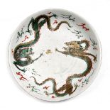 A Chinese famille verte large shallow dish 18th/19th Century decorated with dragons and clouds,