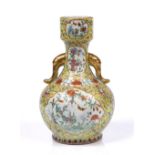 A Chinese two handled bottle vase Jiaqing famille rose enamels with two main quatrefoil reserves