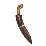 A Kukri with horn handle in a carved wood scabbard