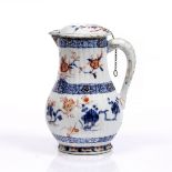 A Chinese Imari lidded jug Qianlong (1735-1796) painted with red and blue scrolling flowers, 22cm