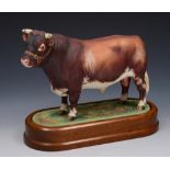 A ROYAL WORCESTER MODEL of a Dairy Shorthorn Bull by Doris Lindner 1965, 24cm lg on wooden stand