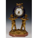 A FRENCH GILT METAL AND BLUE PORCELAIN MANTEL CLOCK painted white enamel dial and rouge marble base,