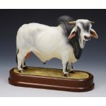 A ROYAL WORCESTER MODEL of a Brahman Bull by Doris Lindner 1968 numbered 328F, 23.5cm lg on wooden