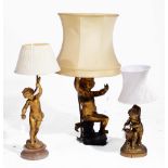 A GROUP OF THREE GILT METAL TABLE LAMPS in the form of putti, 44, 41 and 33cm h (3)