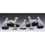 THREE PAIRS OF STAFFORDSHIRE POTTERY SEATED DALMATIANS and one further, 15cm to 7cm h (7)