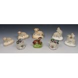 A GROUP OF FIVE STAFFORDSHIRE MODELS of sheep, 8.4cm to 6.5cm h; and a further model of a seated