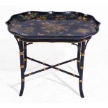 AN EARLY VICTORIAN BLACK LACQUERED TEA TRAY with gilded decoration on a later simulated bamboo