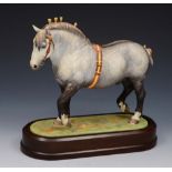 A ROYAL WORCESTER MODEL of a Percheron Stallion by Doris Lindner 1965, 23.5cm lg on a wooden stand