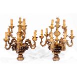 A PAIR OF ITALIANATE CARVED GILTWOOD NINE BRANCH CHANDELIERS with applied fruit decoration,