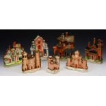 A GROUP OF SEVEN STAFFORDSHIRE TERRACOTTA AND WHITE GLAZED PASTILLE BURNERS of gothic cottage