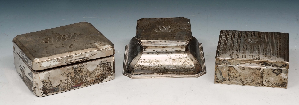 A LATE VICTORIAN SILVER DESK INKWELL with square tapering form and canted corners, hinged lid with
