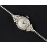 A LADY'S DIAMOND SET COCKTAIL WATCH, the circular silvered dial with Arabic numerals, to a