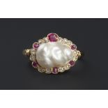 A NATURAL BLISTER PEARL, RUBY AND DIAMOND RING, the baroque blister pearl framed by a shaped