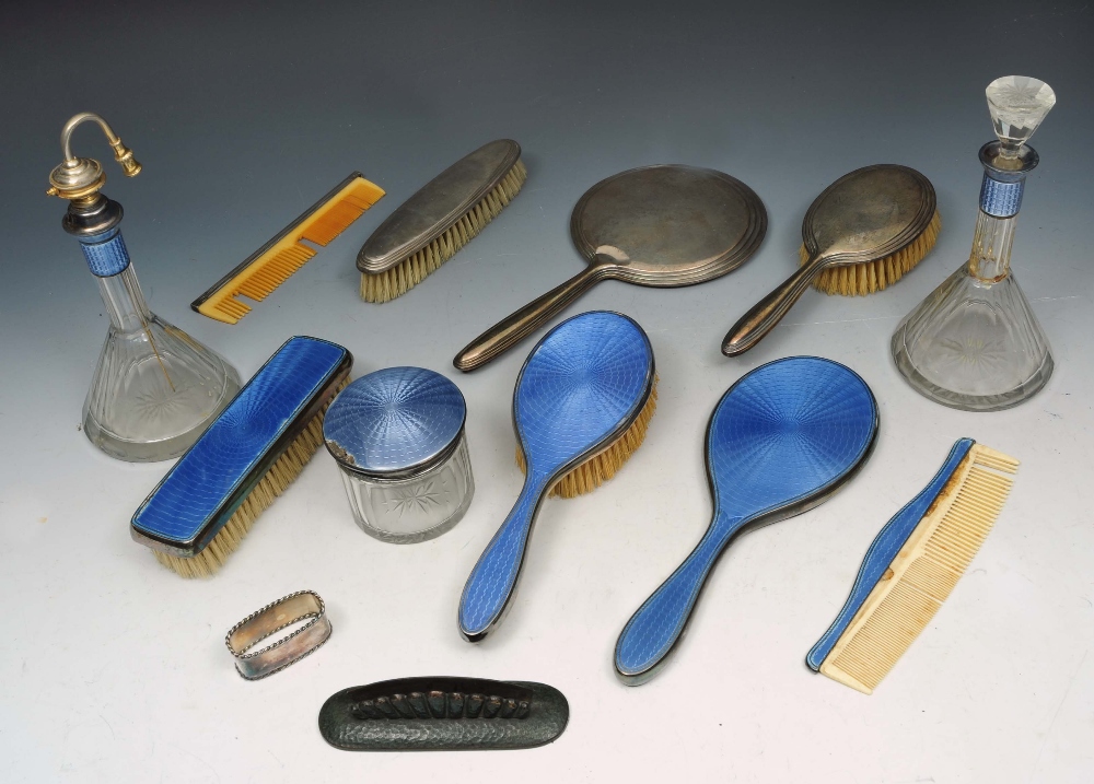 A GERMAN BLUE ENAMELLED DRESSING TABLE SET TO INCLUDE: a hand mirror, hairbrush, clothes brush,