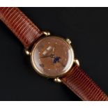 A GENTLEMAN'S MOONPHASE WRISTWATCH BY TIFFANY & CO, the circular copper-coloured dial with gilt