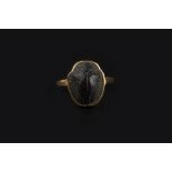 A SCARAB RING, the yellow precious metal mount stamped 'SH 22ct', ring size O