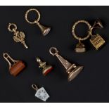 A COLLECTION OF 19TH CENTURY AND LATER FOB SEALS AND WATCH KEYS, variously set with hardstone and