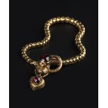 A VICTORIAN GEM SET SERPENT BRACELET, the graduated articulated bracelet modelled as a serpent,