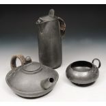 A TUDRIC PEWTER TEAPOT, water jug and basin after Archibald Knox for Liberty & Co., No. 0321, Jug