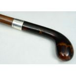 A MALACCA WALKING STICK with tortoiseshell handle and silver ferrule, hallmarked London 1924, makers