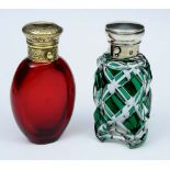 A VICTORIAN RUBY GLASS AND SILVER GILT MOUNTED SCENT BOTTLE, 8.4cm high; and another green and clear