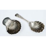 A GEORGE III SILVER CADDY SPOON with a shell shaped bowl and gadrooned handle, 6.2cm long, London