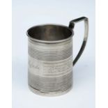 A GEORGE III SILVER CHRISTENING MUG with reeded decoration and a foliate band, 7cm high, London 1811