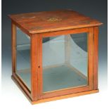 A SATINWOOD BIJOUTERIE CABINET with painted ribbon swag and cherub decoration, one glass shelf, 30cm