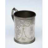 A VICTORIAN SILVER CHRISTENING MUG with a beaded edge and scroll and foliate engraved panels, 8.